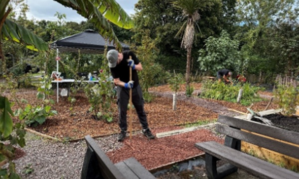 A volunteer hard at work in the new community garden Credit Phil Graham