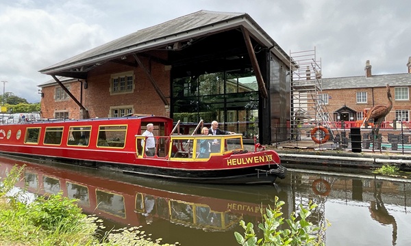 Dame Nia Griffith viewing the improvements to Y Lanfa in Welshpool from the Heulwen Trust canal boat.