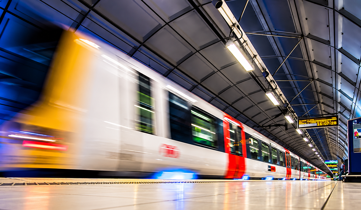 High-Speed Train Through Modern Station
