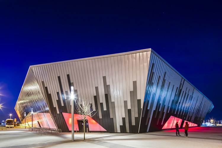Exterior view of the Ice Arena Wales at night, designed by Scott Brownrigg, Cardiff, Wales, UK.