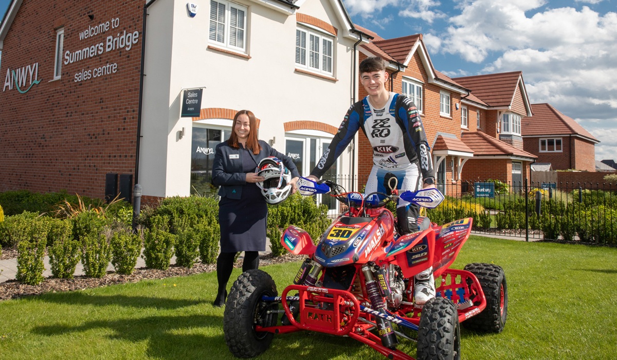 Anwyl Homes community fund donation to Louie Holt the Under-21 British Quadcross Champion for 2025. Pictured Kerry Carter of Anwyl with Louie Holt.