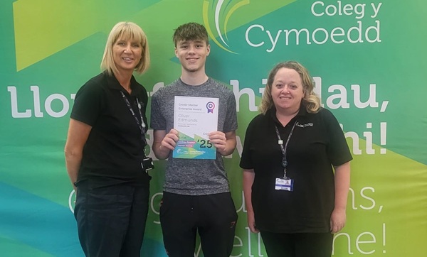 Oliver Edmunds receiving an entreprise award at Coleg y Cymoedd