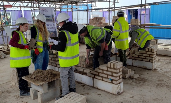 Taylor Wimpey giving pupils from y Deryn group of schools career talk and bricklaying workshop at their Cowbridge site