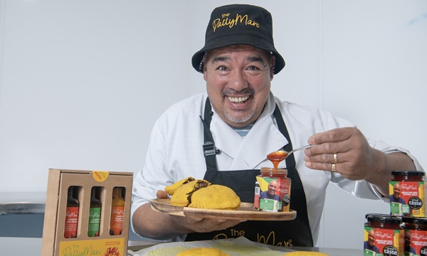 MayKa0008936 DT Weekend Older food entrepreneurs Pix show Leroy Williams, The PattyMan, with his Jamaican patties and sauces in his kitchen in Cardiff, Wales Pix; Jay Williams 02-05-24