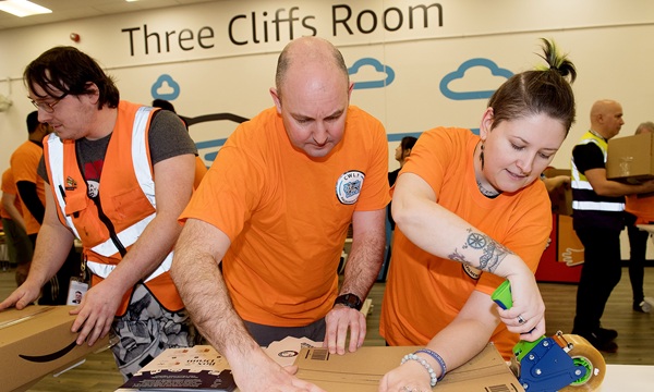 14.01.26 - CWL1 Amazon employees from Swansea take part in a kitting event for the Cwtch Mawr Multibank, packing kits to support young children’s development and build family connections. -