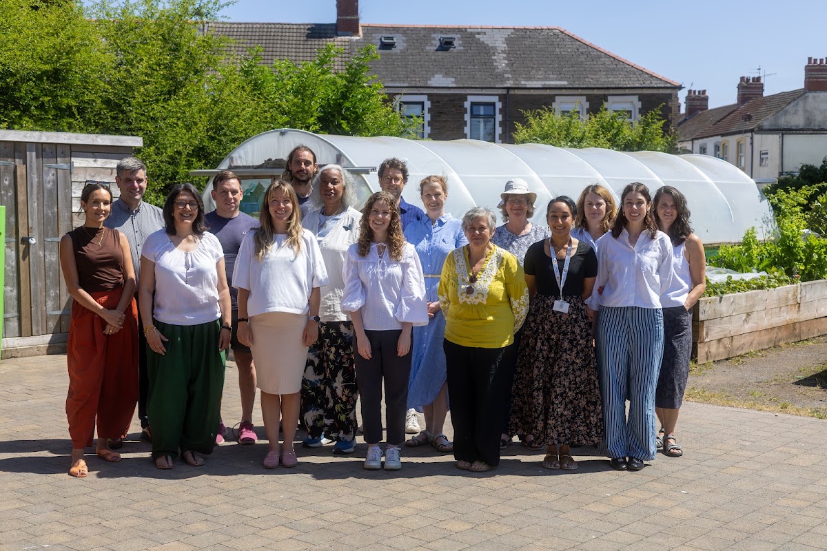 Members of the Food Cardiff Strategy Board standing together outside a community growing space