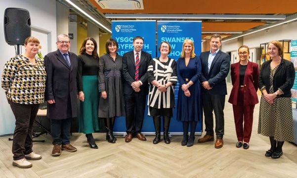 Professor Gareth Davies, Dean of the Institute of Management and Health (5th from left), Professor Elwen Evans, KC, Vice-Chancellor of UWTSD (6th from left) and Dr Bronwen Williams, Head of Swansea Law School (7th from left) are pictured at the launch.